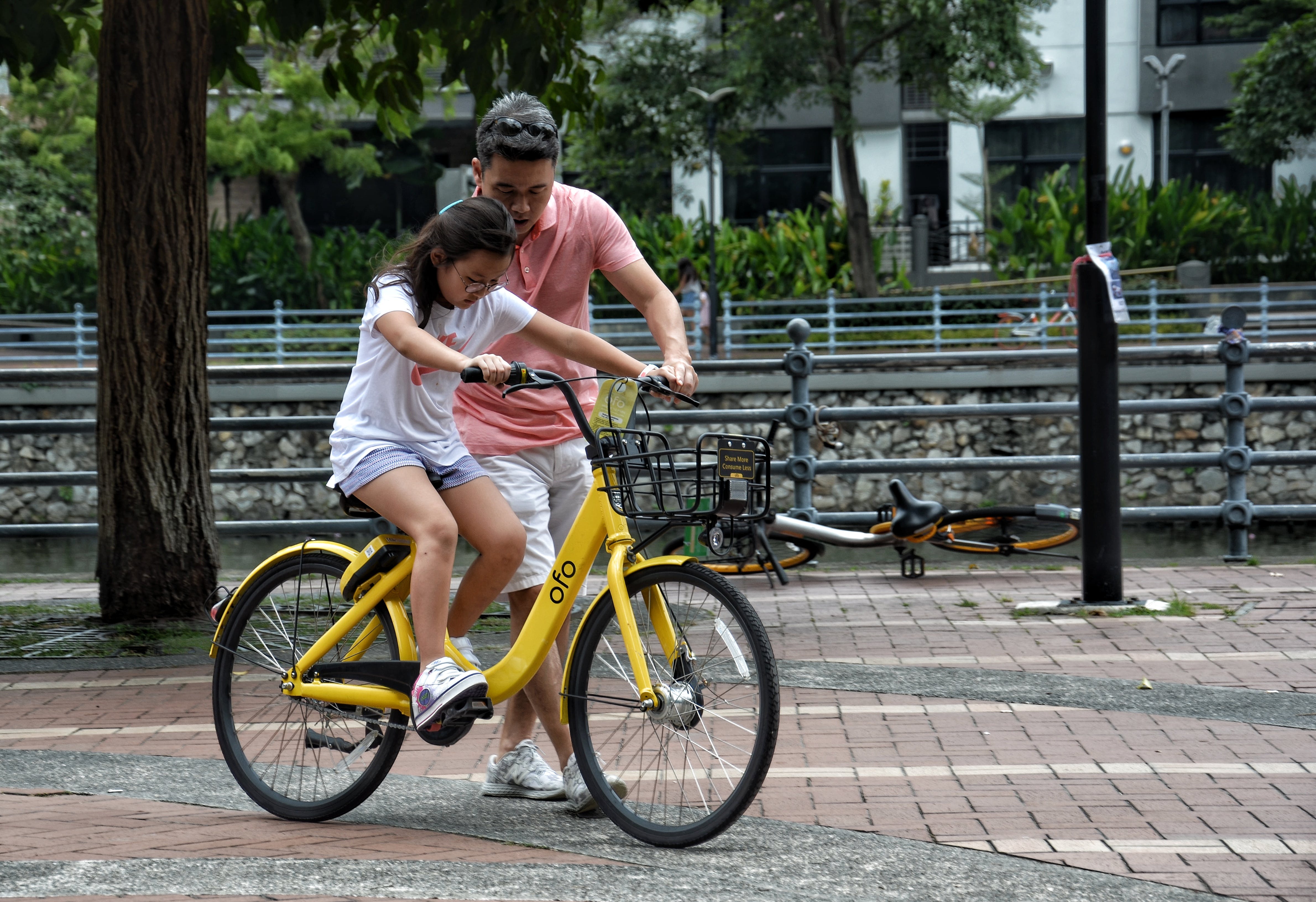 Parent with child on bicycle